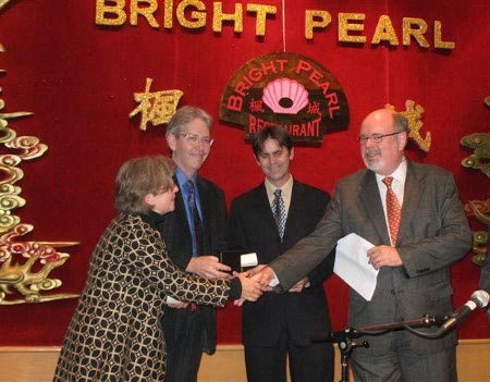 Co-directors Ruth Sandwell, Peter Gossage and John Lutz receive Pierre Berton Prize from his son, Peter Berton.