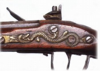 [ HBC Flintlock Detail, Detail of the HBC standard trade musket in use in the Chilcotin in the 1860 and 1870s showing the trademark snake. This one was manufactured in 1878, Unknown,   ]