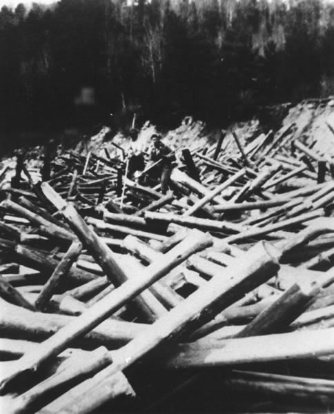 Two men breaking a log jam, in Algonquin Park